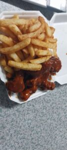 Jay Jay Café Buffalo Wings and Chips in a Takeaway Container